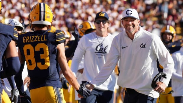 Trond Grizzell congratulated by Justin Wilcox